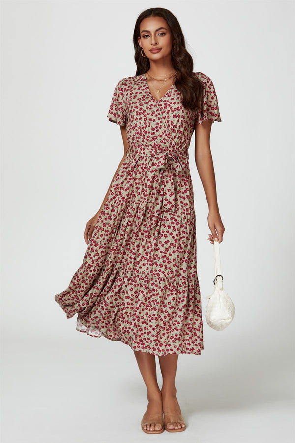 Roze wikkeljurk met bloemenprint in beige