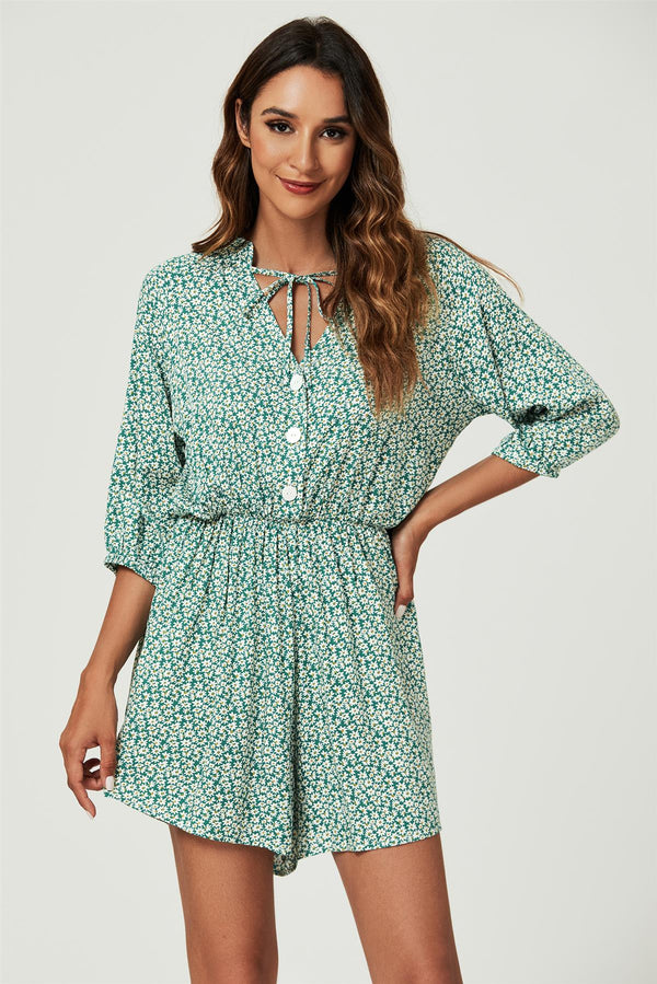 Boho playsuit met madeliefjesprint en knopen in het groen