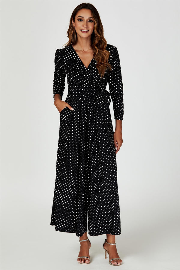 Jumpsuitjurk met stippenprint en wikkeltop in zwart
