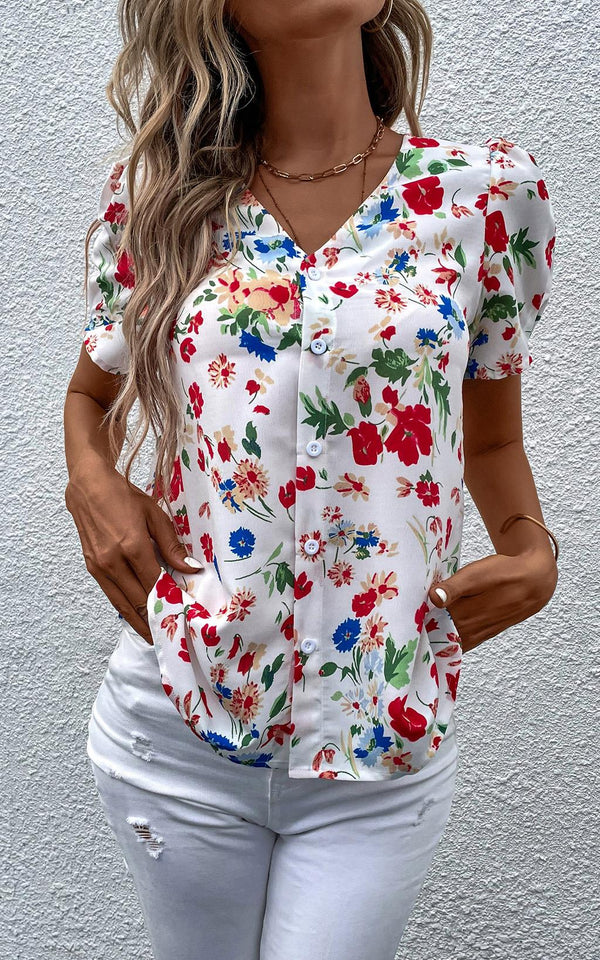Blouse met korte mouwen en knopen in wit en blauw/rode bloemenprint