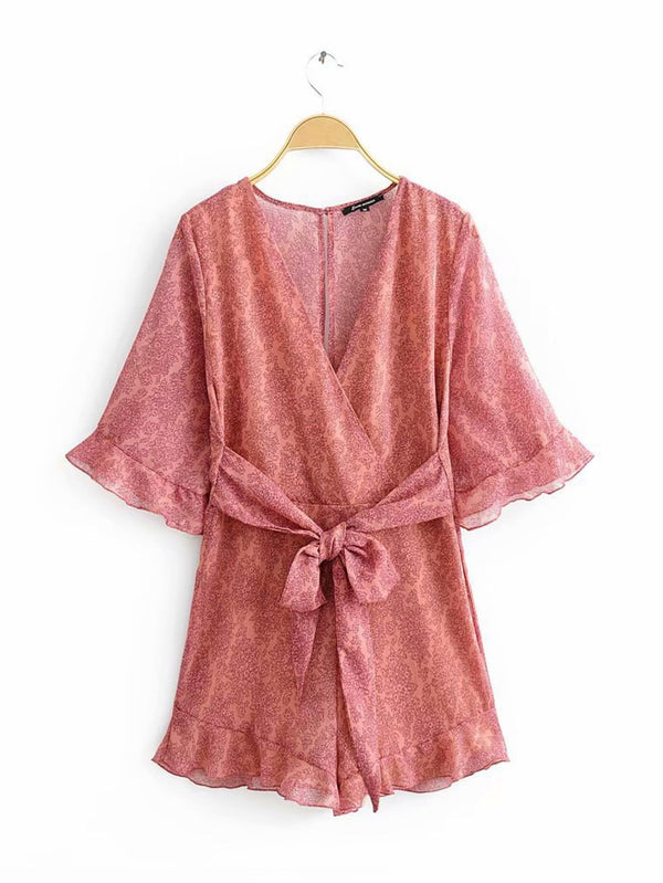 Playsuit met V-hals en rugdetail in perzikkleur met bloemenprint