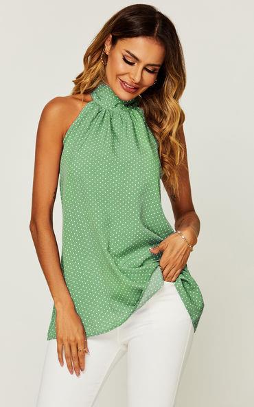 Witte haltertop met stippenprint en strikbandjes in het groen