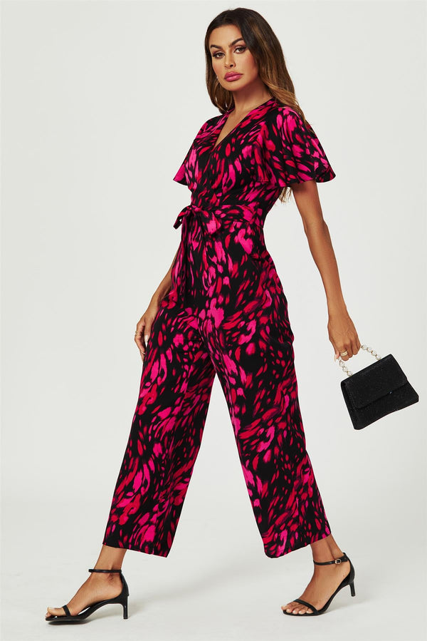 Roze jumpsuit met abstracte print en wikkeltop in zwart