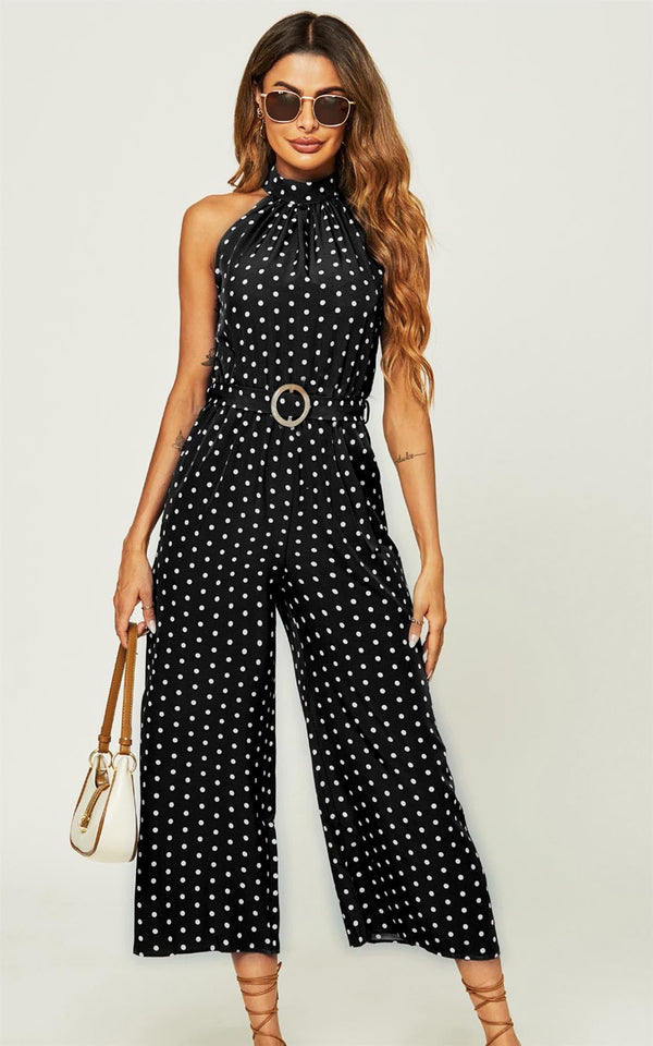 Witte jumpsuit met hoge hals en stippen in het zwart